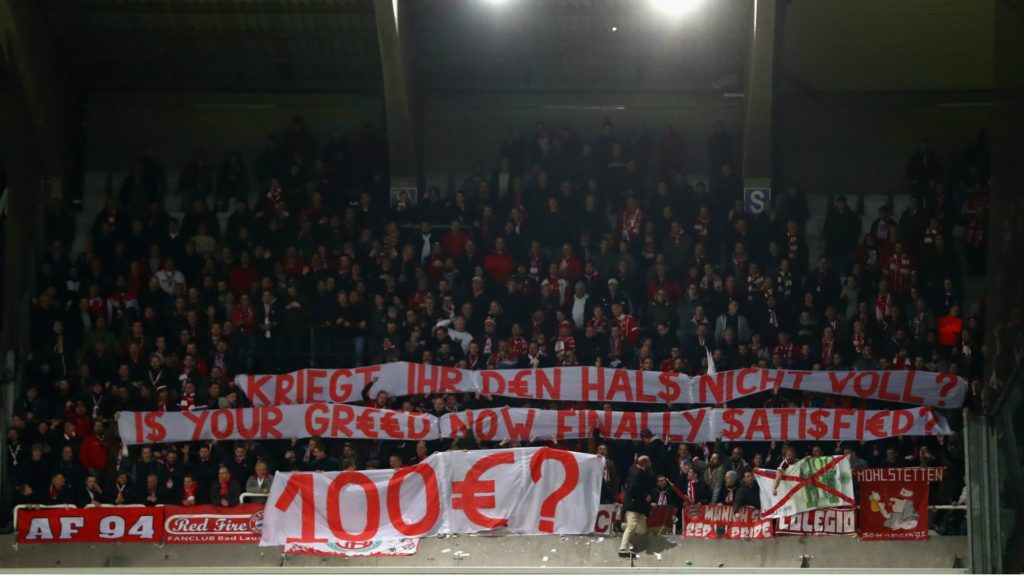 Bayern supporter's banner. Anderlecht banned for overinflated ticket prices.